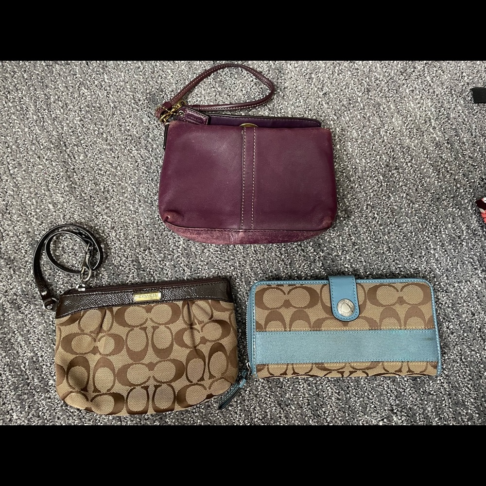1 Coach Wallet and two coach wristlets in used condition.